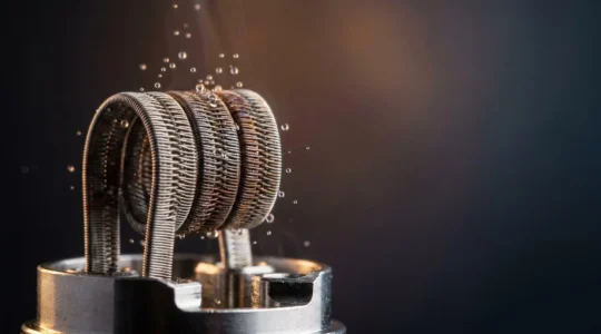 Close-up of vape coil glowing at different temperatures showing vapor density variation