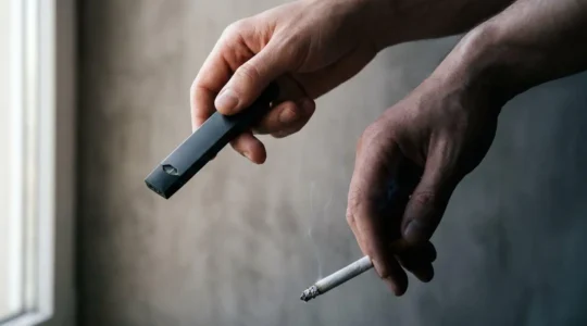 Modern vaping pod system contrasted with traditional cigarette showcasing technological evolution in smoking cessation