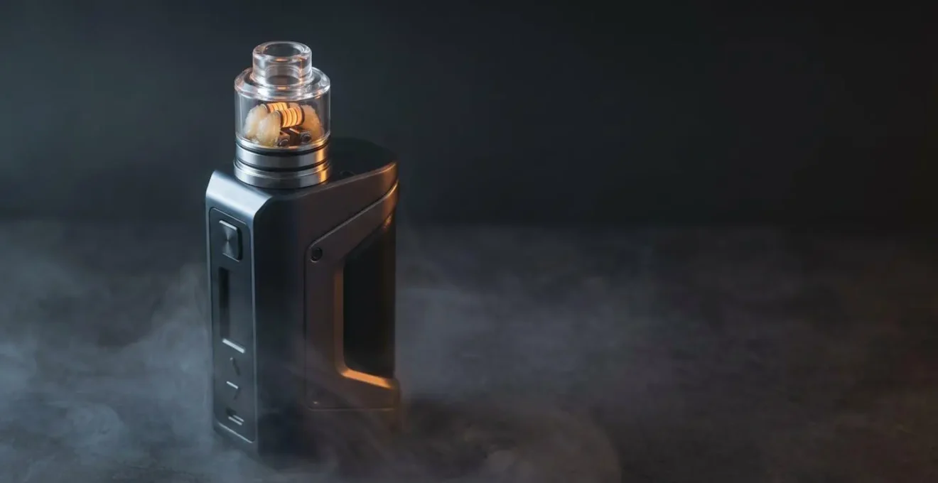 High-performance dual coil RDA vaping device with premium mod in dramatic atmospheric lighting showcasing cloud competition equipment